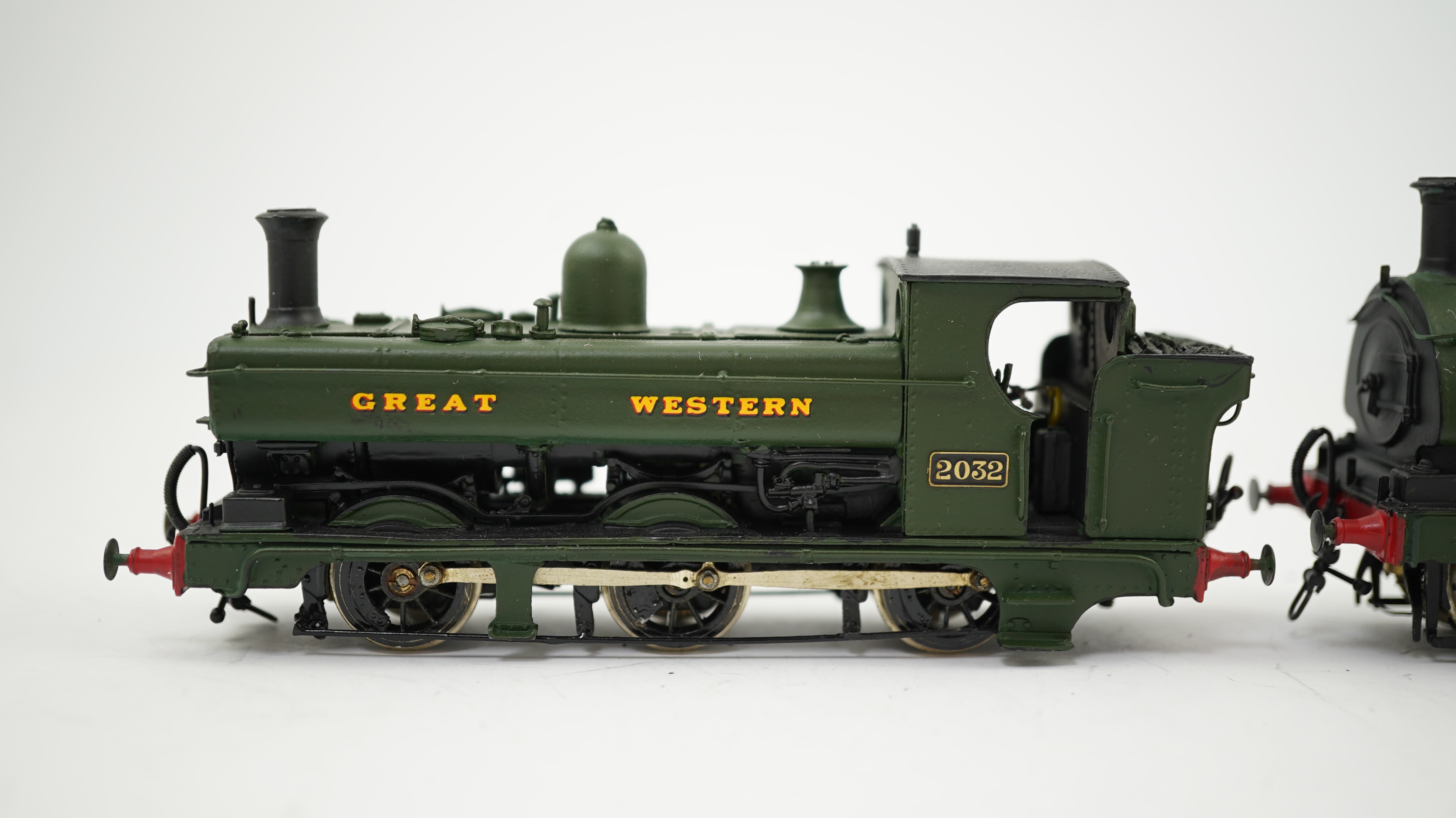 Two 00 gauge brass and white metal kit built GWR tank locomotives; a 2021 class 0-6-0PT, 2032, together with an 1854 class 0-6-0ST, 1858, constructed, painted and lined to a high standard, both motored for two rail opera